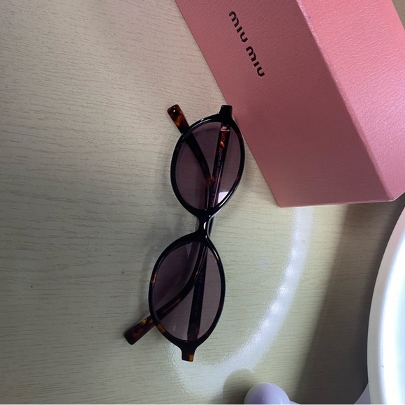 Miu Miu Tortoise Sunglasses with Purple Lenses
